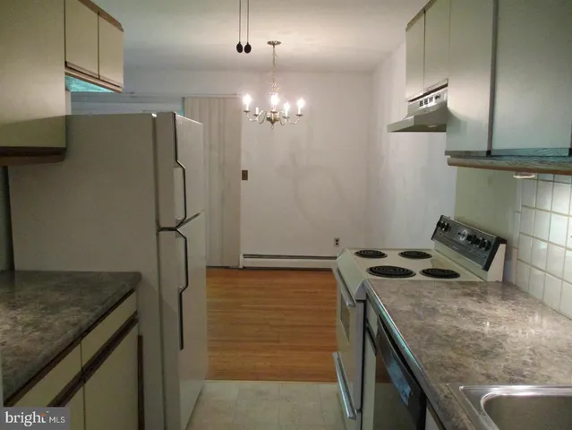 a kitchen that has a cabinets and a stove