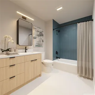 a bathroom with a double vanity sink toilet mirror and bathtub