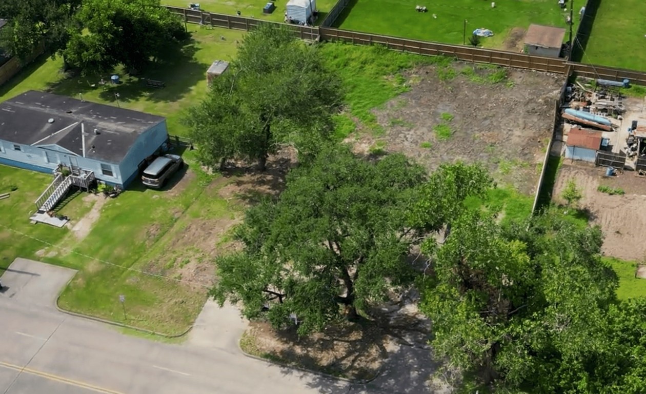 306 Present Street Stafford, TX 77477 - Photo 3 of 6 an aerial view of a house with a yard basket ball court and outdoor seating