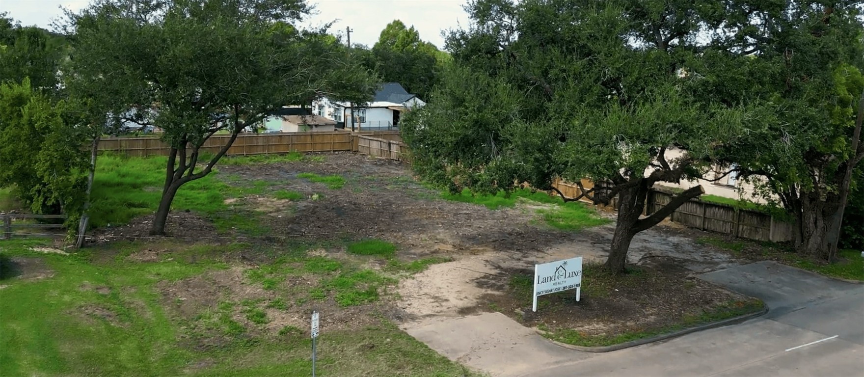 306 Present Street Stafford, TX 77477 - Photo 5 of 6 a backyard of a house with lots of green space