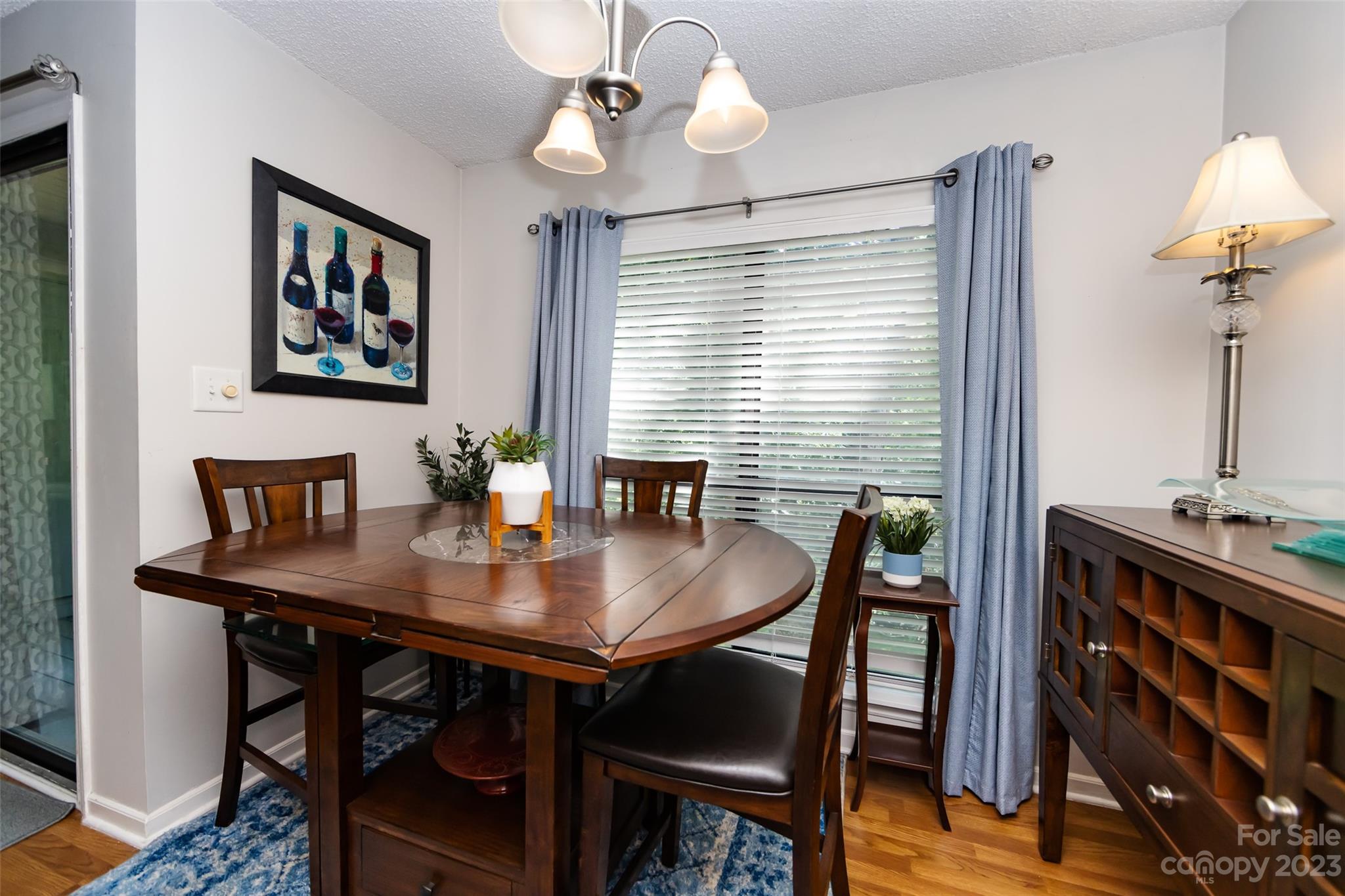 11114 Harrowfield Road Charlotte, NC 28226 - Photo 13 of 25 a view of a dining room with furniture window and wooden floor
