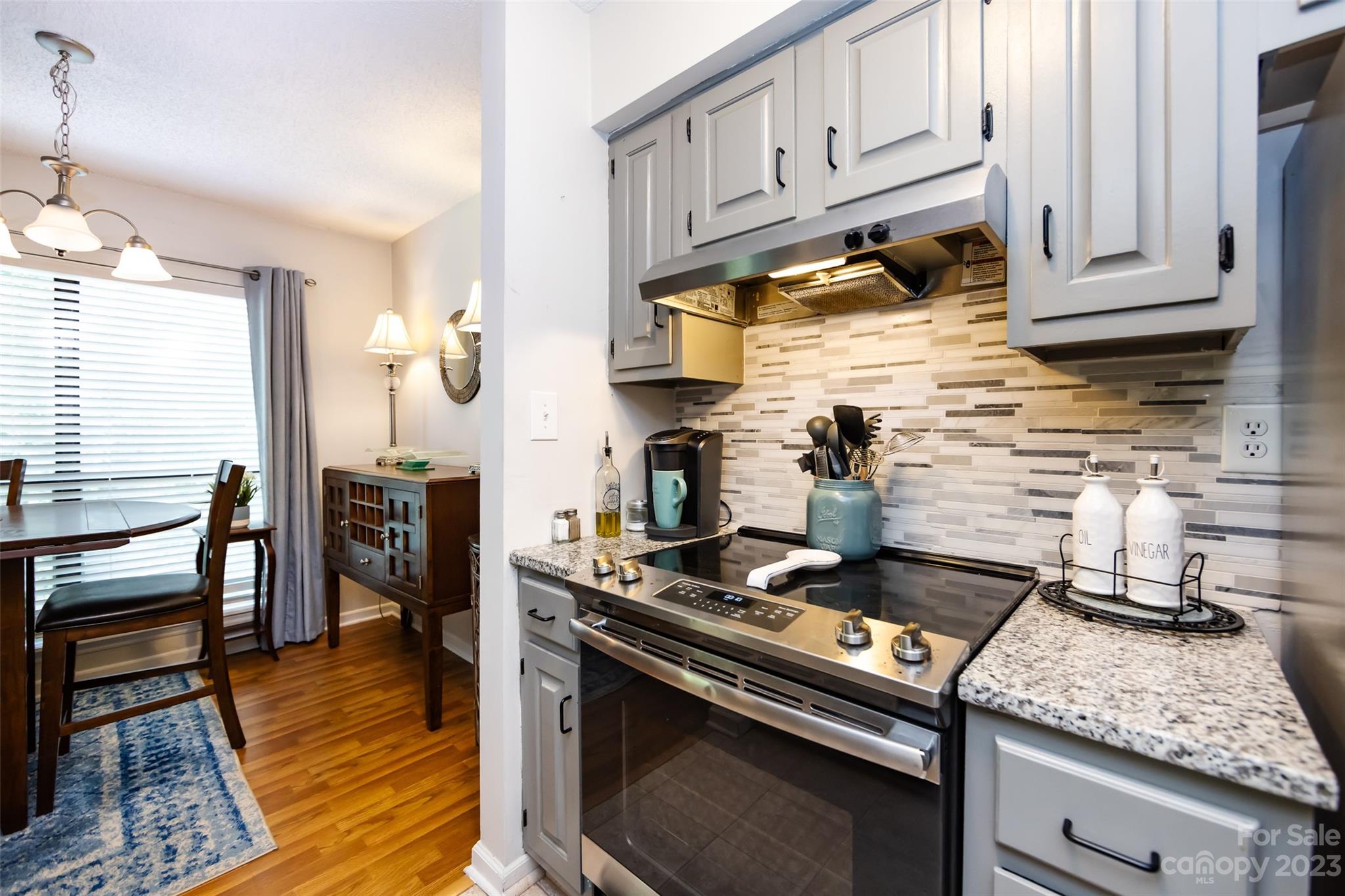 11114 Harrowfield Road Charlotte, NC 28226 - Photo 17 of 25 a kitchen with stainless steel appliances granite countertop a stove and a cabinets