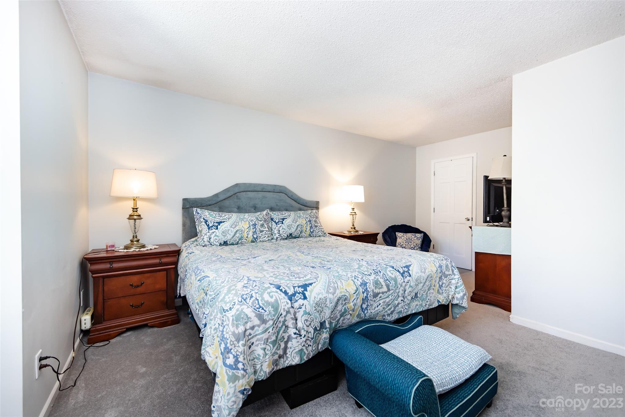 11114 Harrowfield Road Charlotte, NC 28226 - Photo 20 of 25 a bedroom with a bed and a night stand