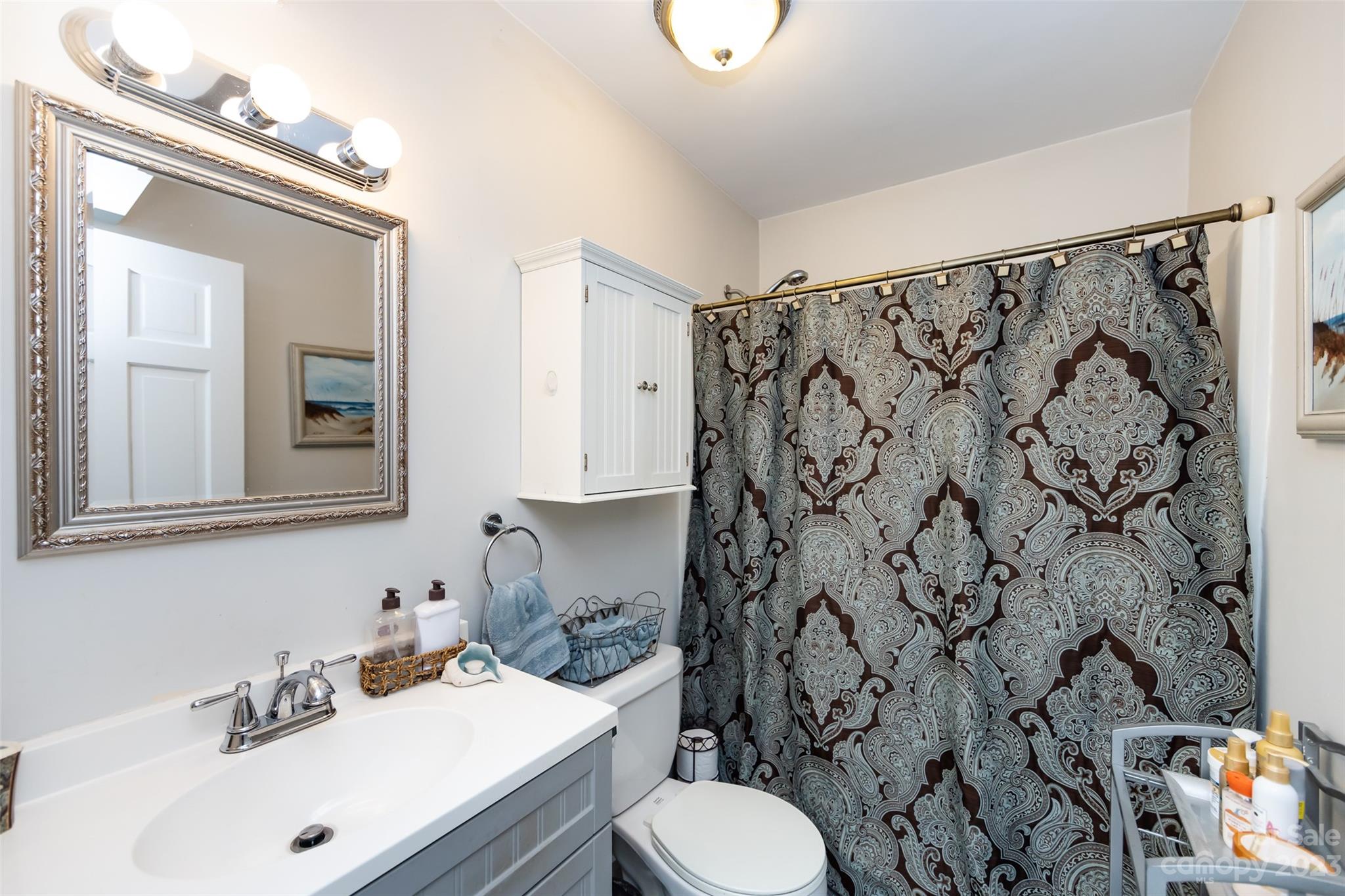 11114 Harrowfield Road Charlotte, NC 28226 - Photo 21 of 25 a bathroom with a sink toilet and shower