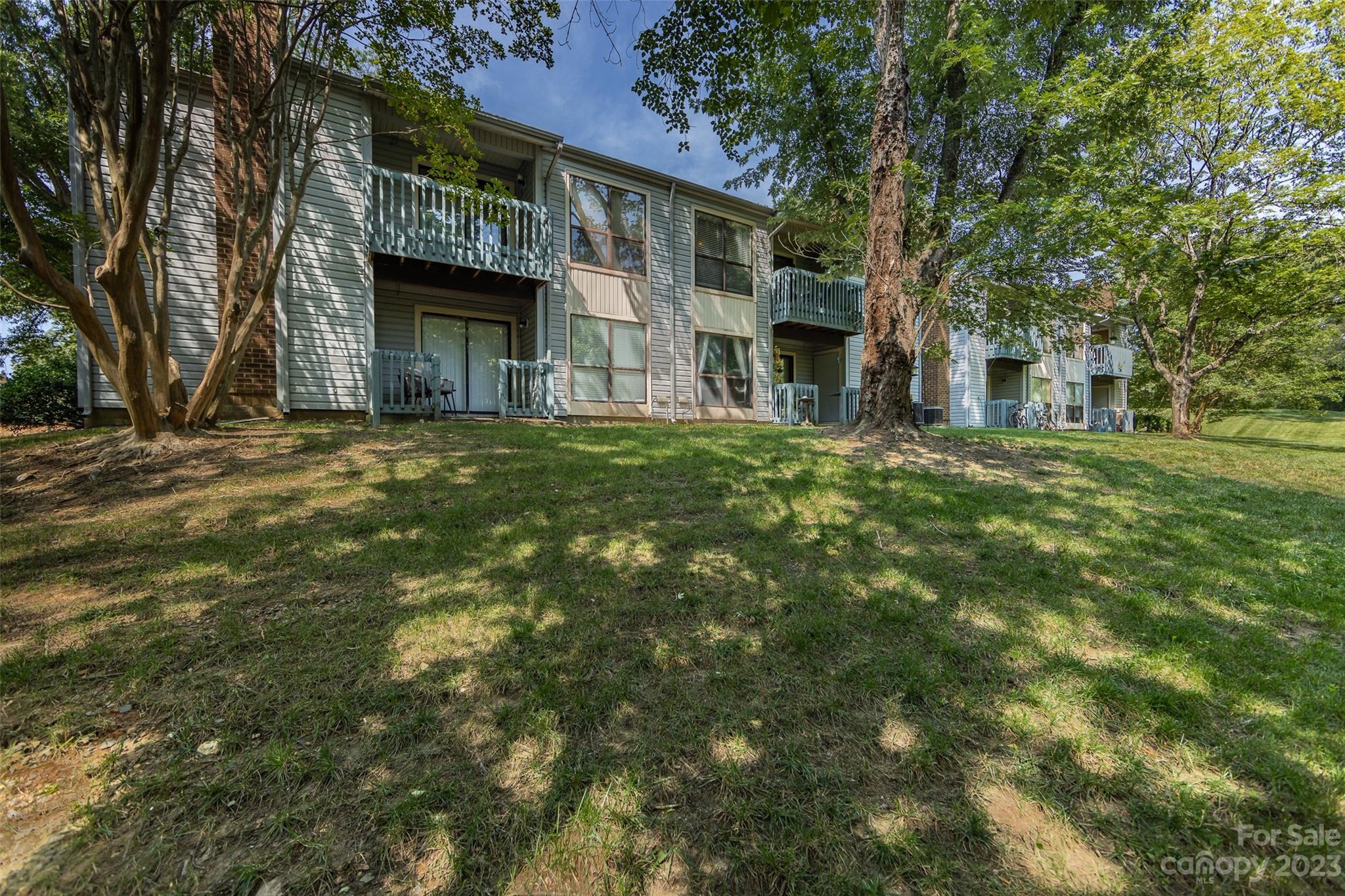 11114 Harrowfield Road Charlotte, NC 28226 - Photo 23 of 25 a front view of a house with a garden