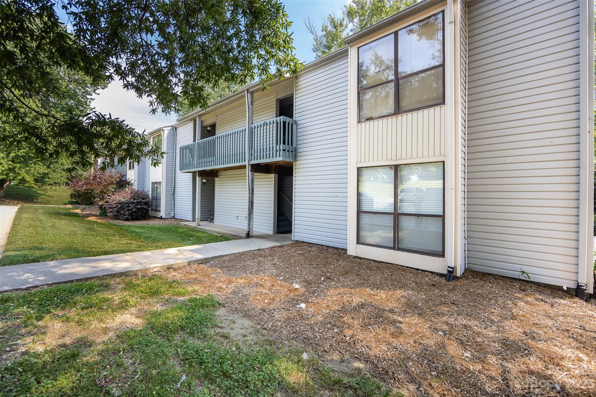11114 Harrowfield Road Charlotte, NC 28226 - Photo 4 of 25 a view of backyard of house with entertaining space
