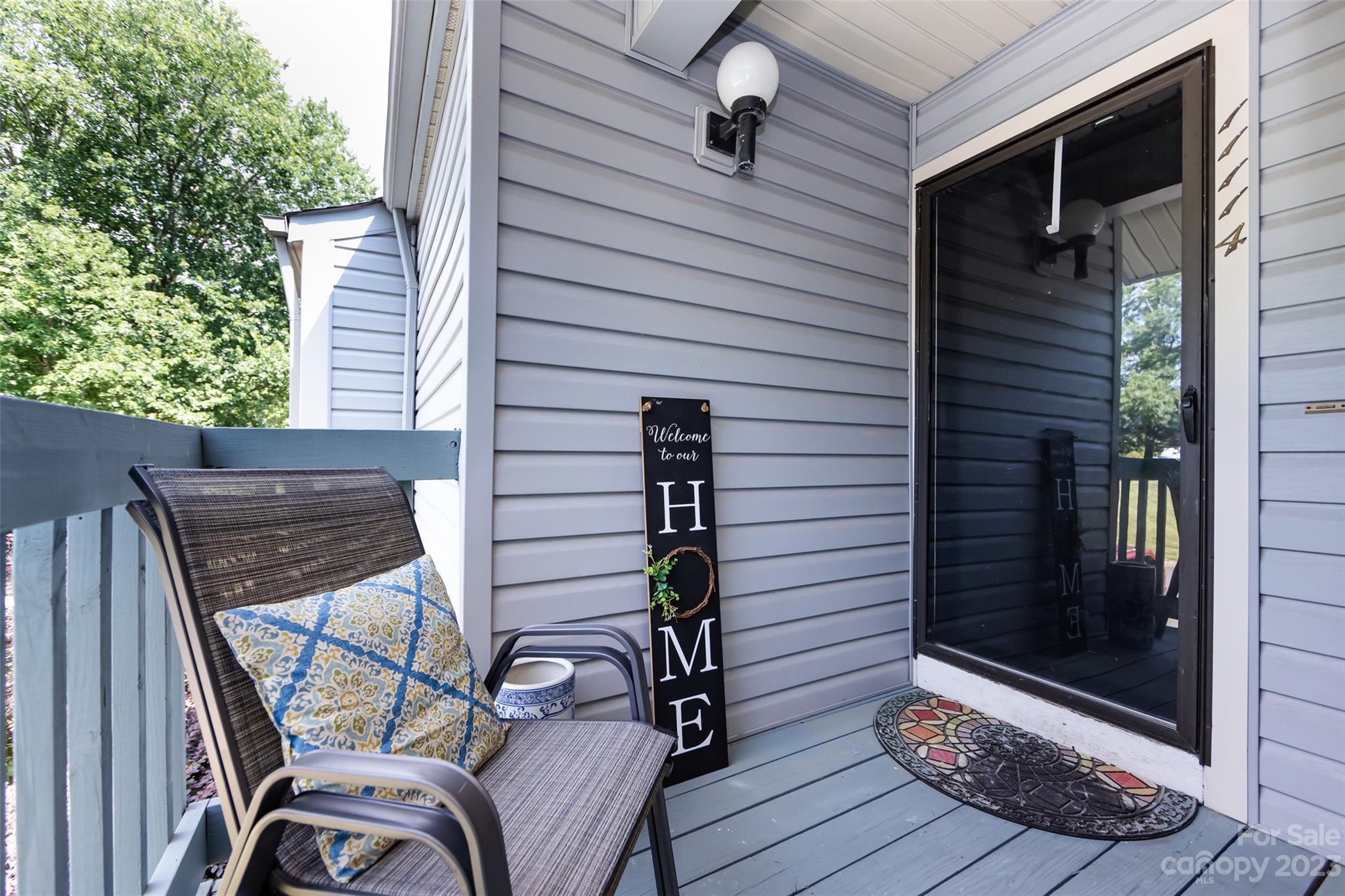 11114 Harrowfield Road Charlotte, NC 28226 - Photo 5 of 25 a view of a balcony with chairs and wooden fence