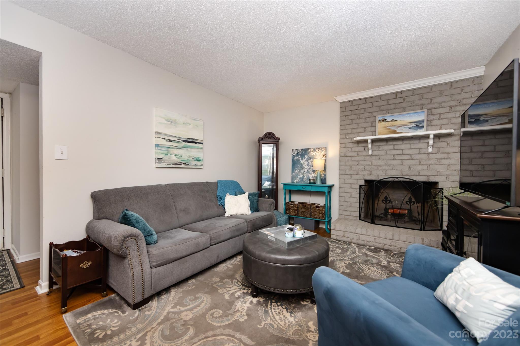 11114 Harrowfield Road Charlotte, NC 28226 - Photo 7 of 25 a living room with furniture and a fireplace