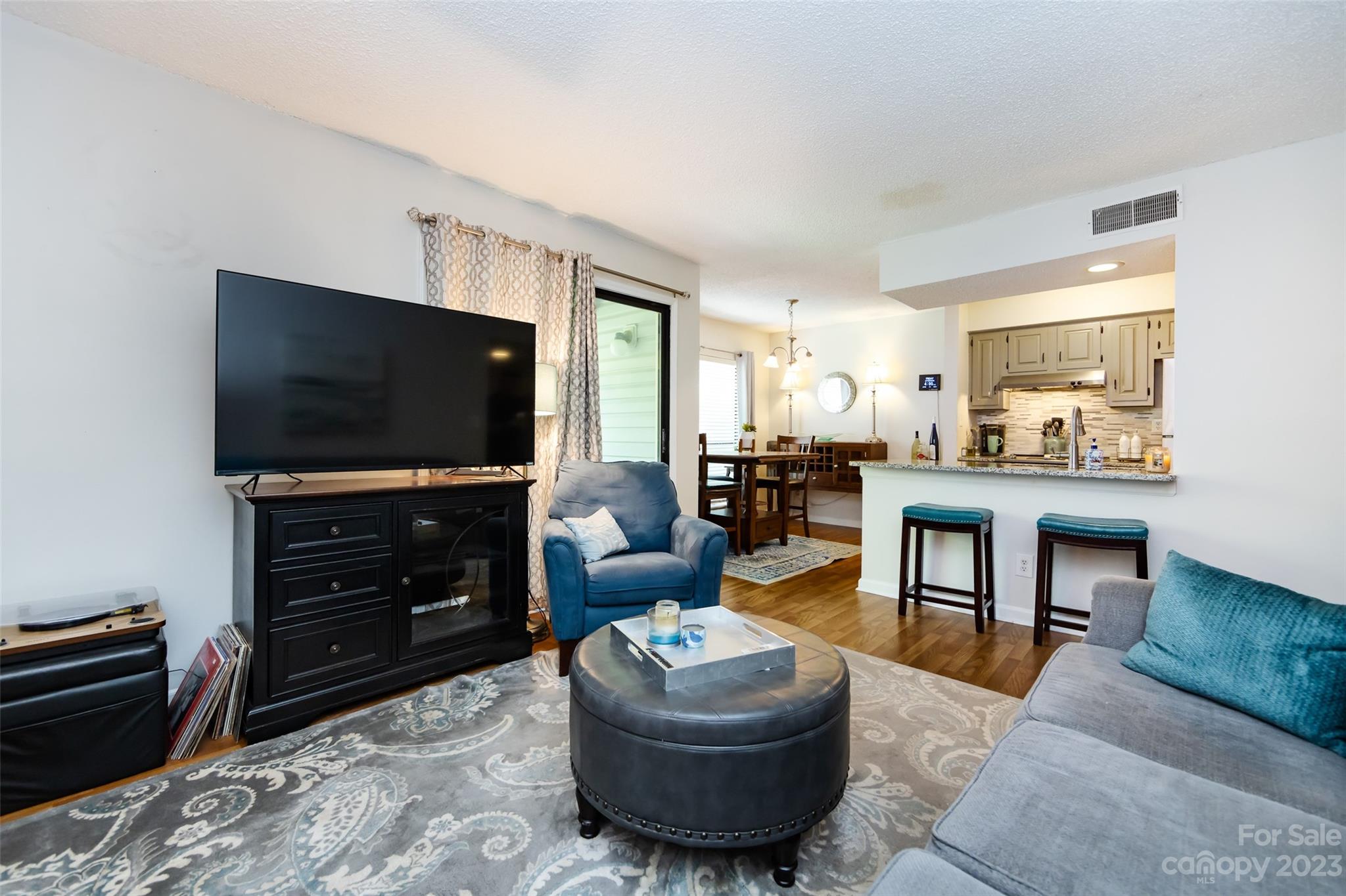 11114 Harrowfield Road Charlotte, NC 28226 - Photo 9 of 25 a living room with furniture and a flat screen tv