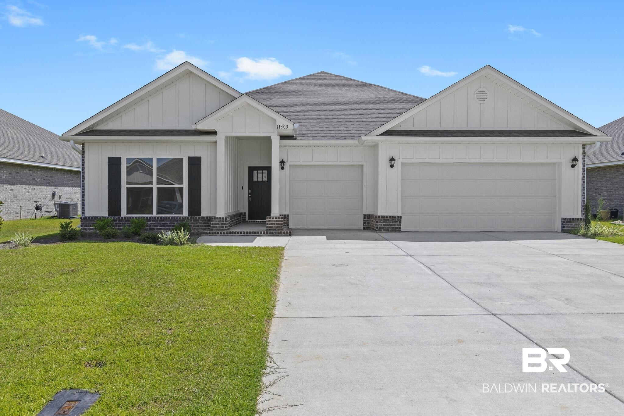 11303 Genuine Risk Circle Daphne, AL 36526 - Photo 1 of 100 View of front of property with a front lawn, central AC, and a garage