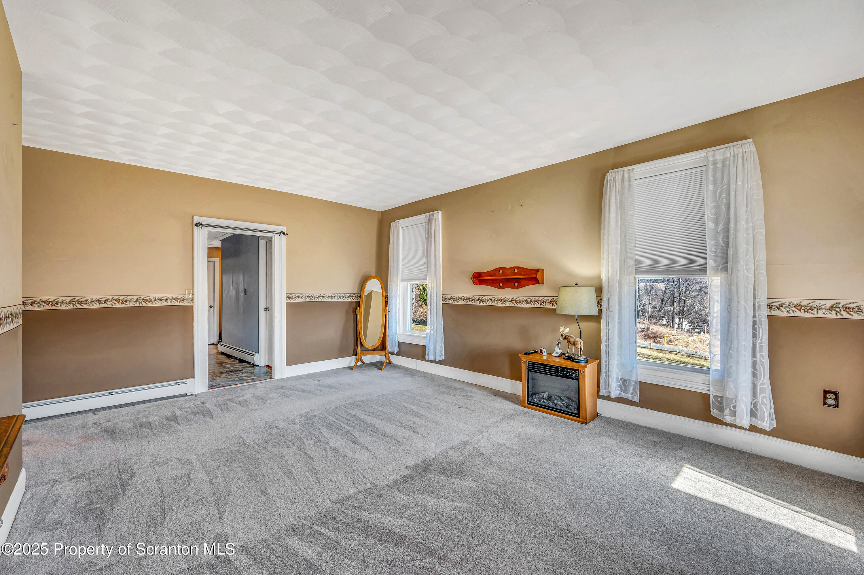 5115 State Rte 3013 Springville, PA 18844 - Photo 43 of 74 a view of a livingroom with furniture and a window