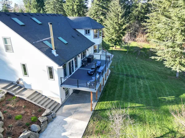 a view of a house with backyard porch and sitting area