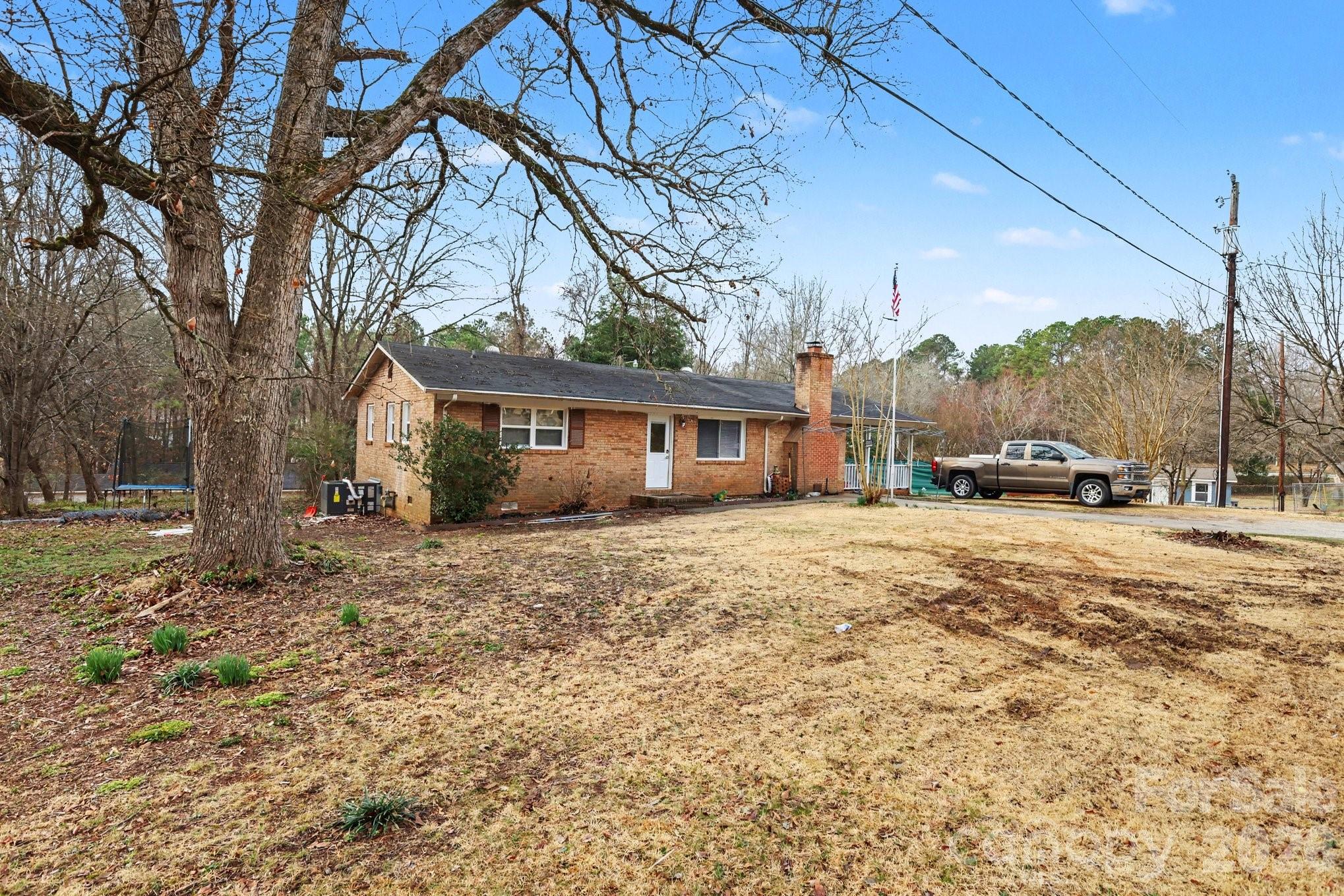 128 Paul Snipes Road Lancaster, SC 29720 - Photo 3 of 29 a view of a house with a yard covered in snow