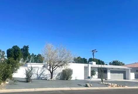 a view of a house with a street