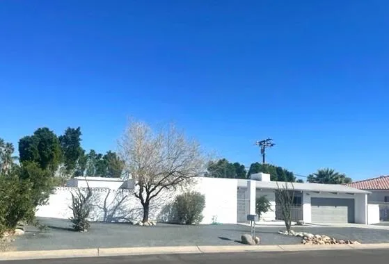 a view of a house with a street
