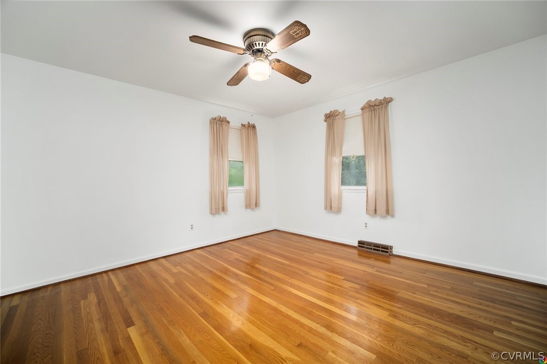 13304 South Chester Road Chester, VA 23831 - Photo 17 of 46 wooden floor in an empty room with a window