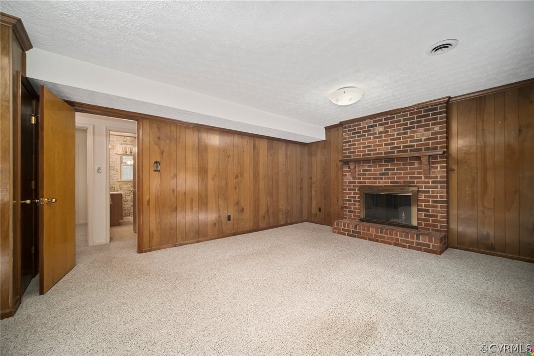 13304 South Chester Road Chester, VA 23831 - Photo 23 of 46 a view of an empty room with a fireplace