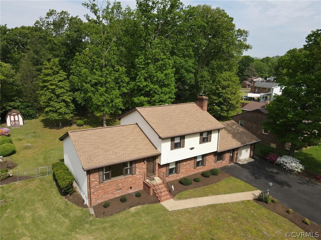 13304 South Chester Road Chester, VA 23831 - Photo 41 of 46 an aerial view of a house with a yard table and chairs