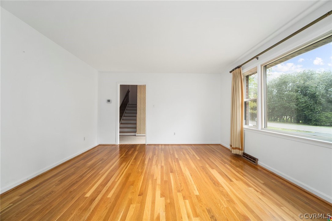 13304 South Chester Road Chester, VA 23831 - Photo 5 of 46 a view of a room with wooden floor and white walls