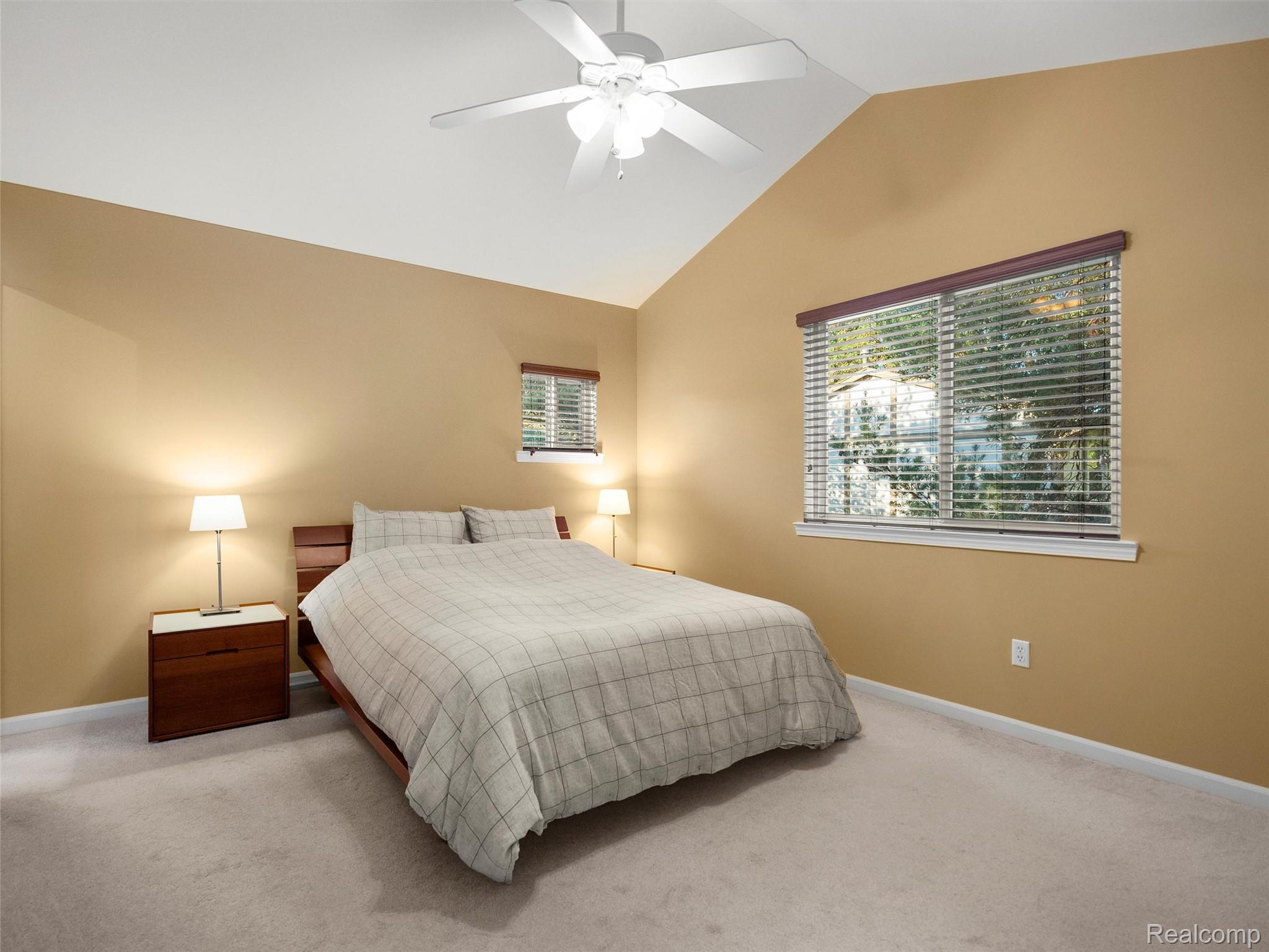 2172 Orpington Road Troy, MI 48083 - Photo 15 of 27 Bedroom with vaulted ceiling, carpet floors, and a ceiling fan