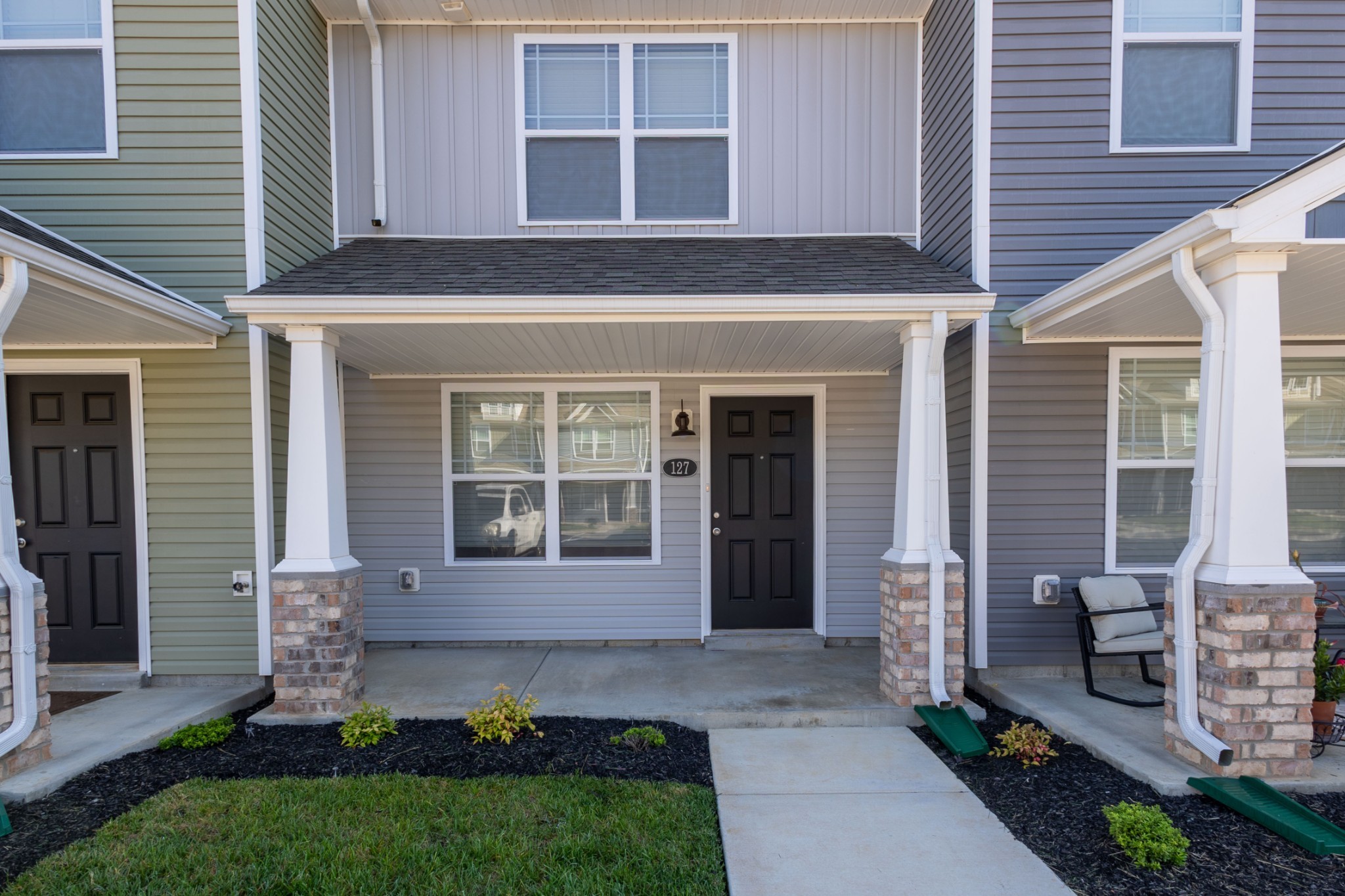 a front view of a house with garden