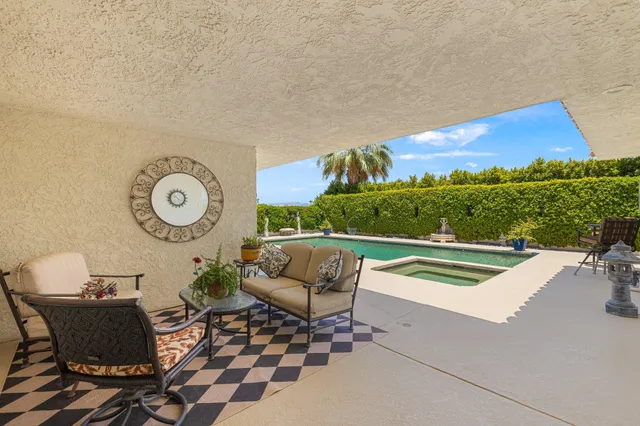 a large bathroom with a tub sink and mirror