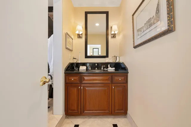 a view of a swimming pool with a lawn chairs and a fire pit