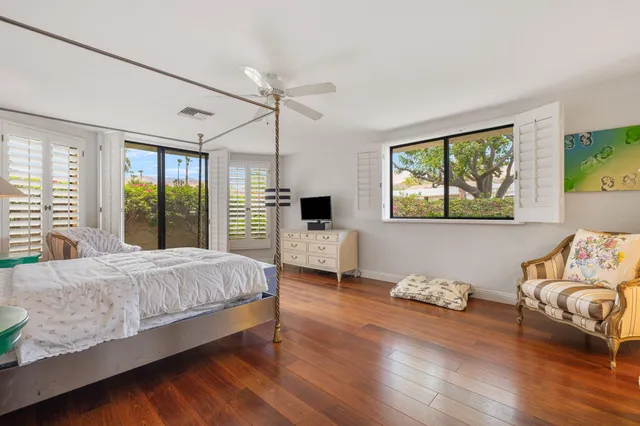 a view of a swimming pool with a yard