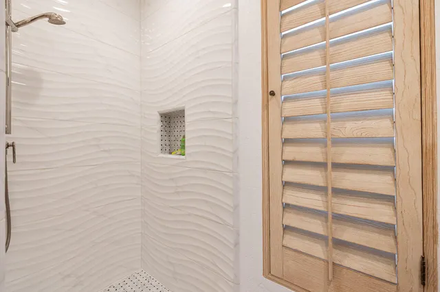 an aerial view of a house with a yard and potted plants