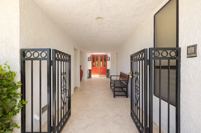 a view of a hallway with seating area