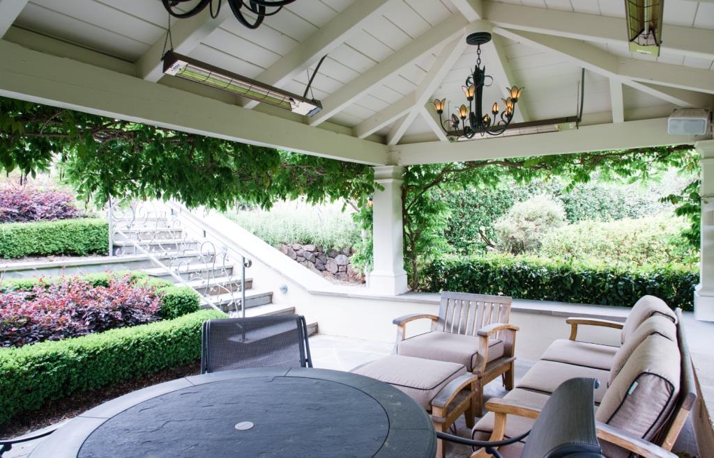 26990 Taaffe Road Los Altos Hills, CA 94022 - Photo 18 of 25 a view of a patio with table and chairs and potted plants