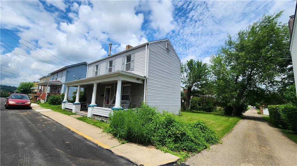 726 North 4th Street Apollo, PA 15613 - Photo 2 of 15 a view of a house with a yard and plants
