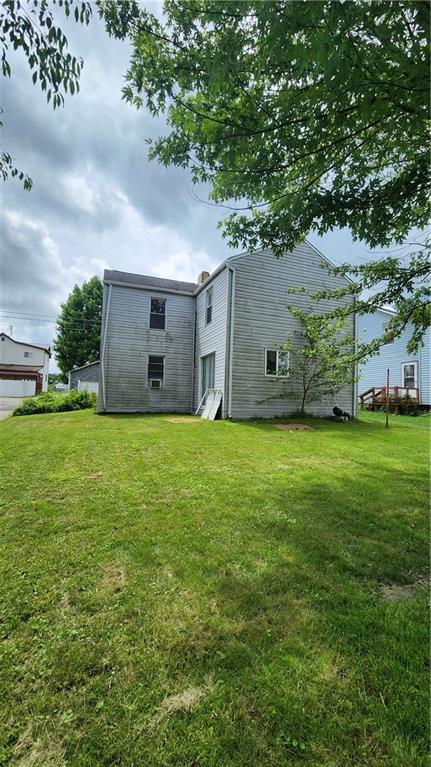 726 North 4th Street Apollo, PA 15613 - Photo 4 of 15 a large house with a big yard and large trees