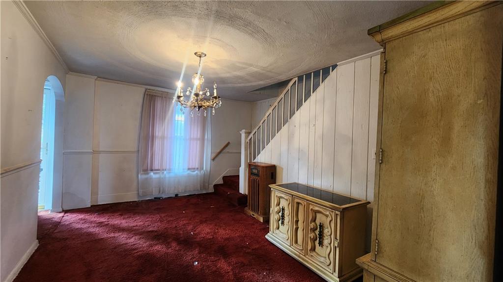 726 North 4th Street Apollo, PA 15613 - Photo 8 of 15 a view of a livingroom with wooden floor and stairs