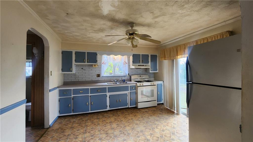 726 North 4th Street Apollo, PA 15613 - Photo 9 of 15 a kitchen with stainless steel appliances a refrigerator sink and microwave