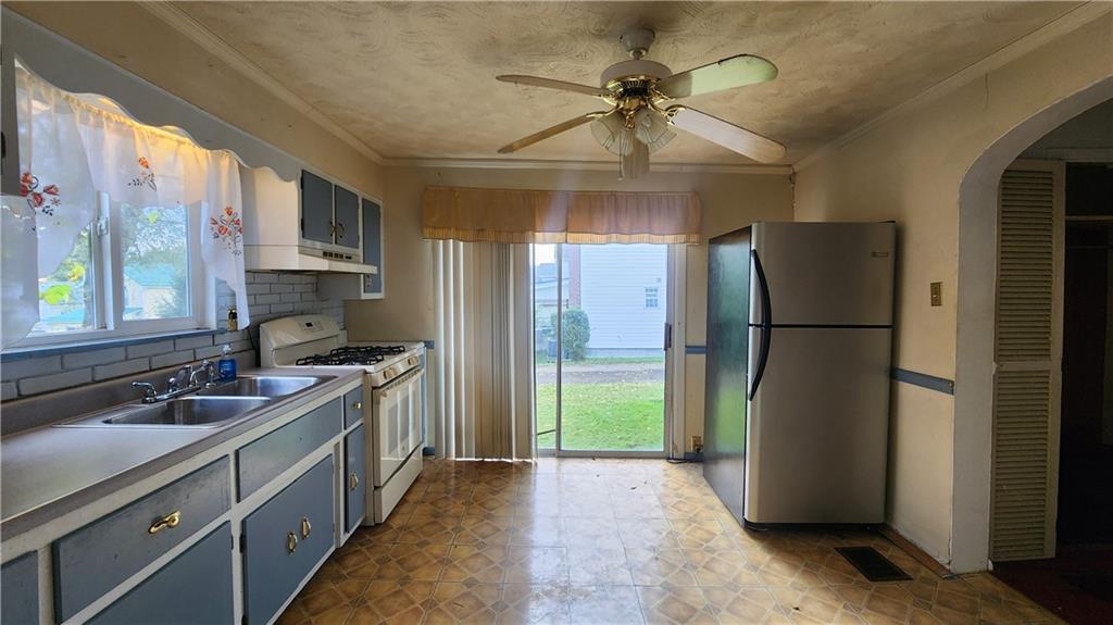 726 North 4th Street Apollo, PA 15613 - Photo 10 of 15 a kitchen with stainless steel appliances granite countertop a refrigerator a sink a stove and a refrigerator