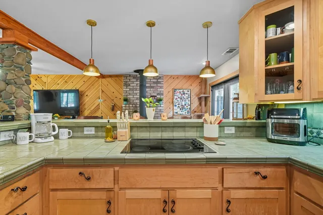 a kitchen with a sink and a window