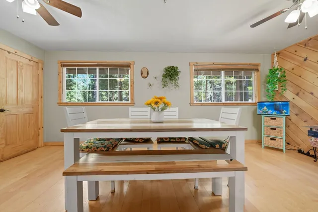 a view of a livingroom with furniture and a flat screen tv
