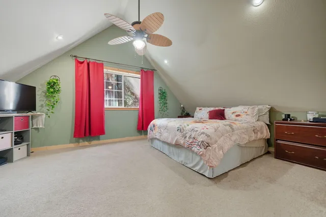 a bathroom with a granite countertop sink a mirror and a shower