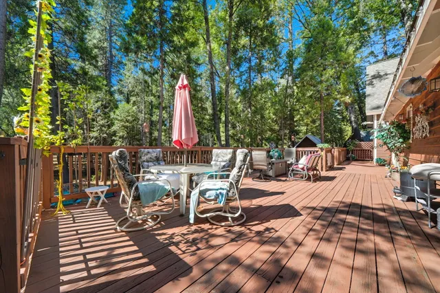 a view of a house with wooden fence