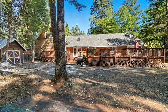 an aerial view of a house with garden space and street view