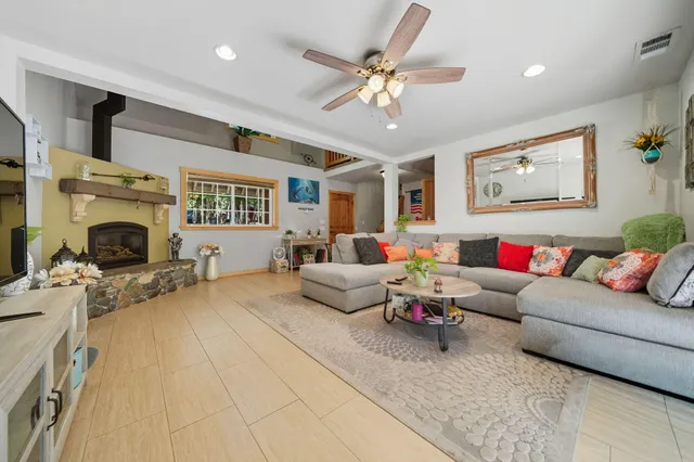 a living room with furniture and a fireplace