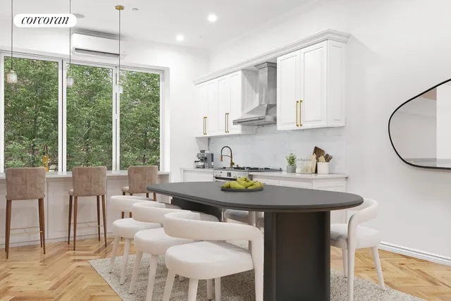 a kitchen with a table chairs stove and white cabinets