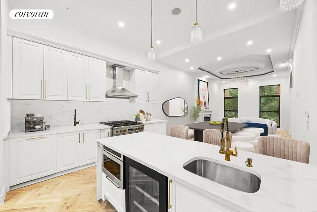 a kitchen with a sink stove and cabinets