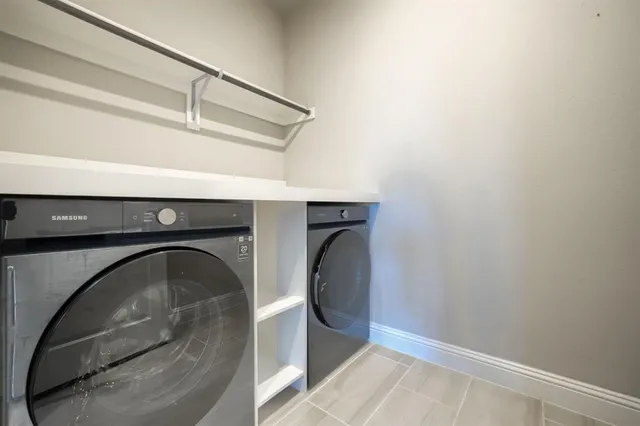 a utility room with dryer and washer