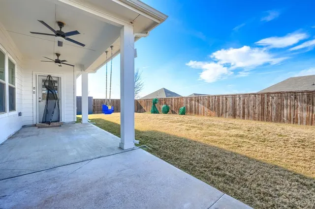 a view of a backyard of the house