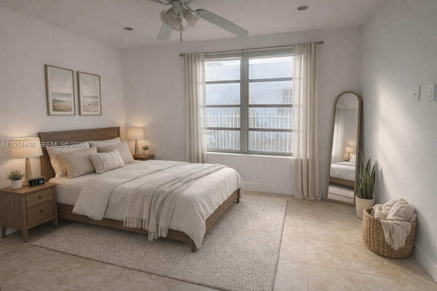 2217 Southwest 11th Street Miami, FL 33135 - Photo 5 of 13 a bedroom with a bed and a window