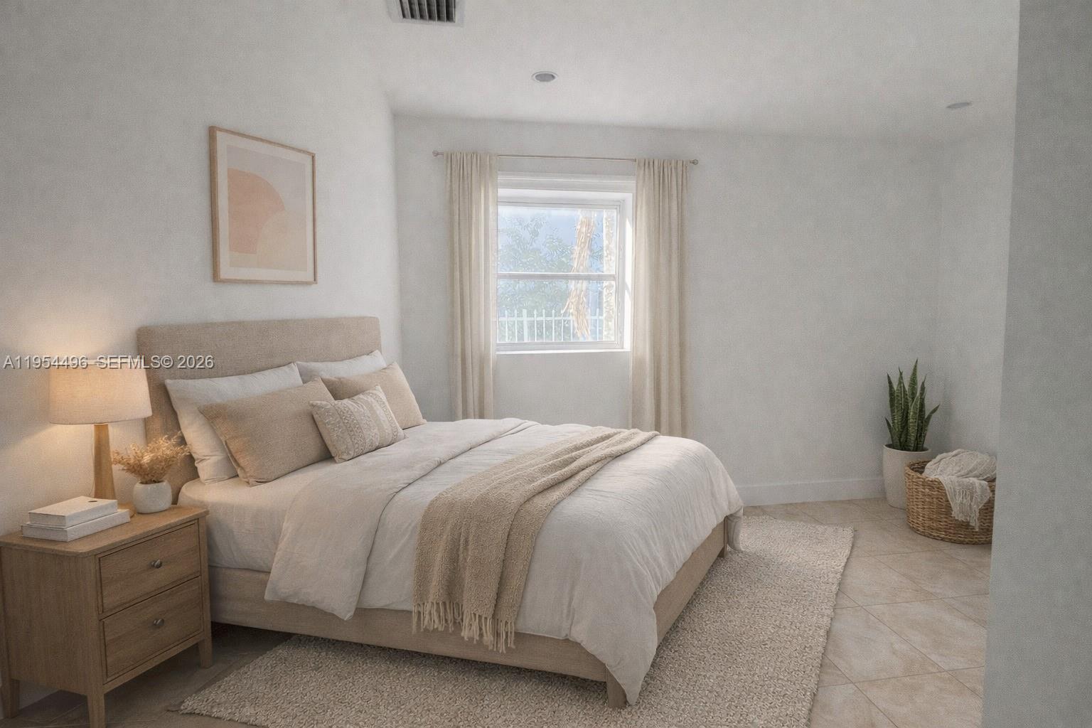 2217 Southwest 11th Street Miami, FL 33135 - Photo 7 of 13 a bedroom with a bed and a window