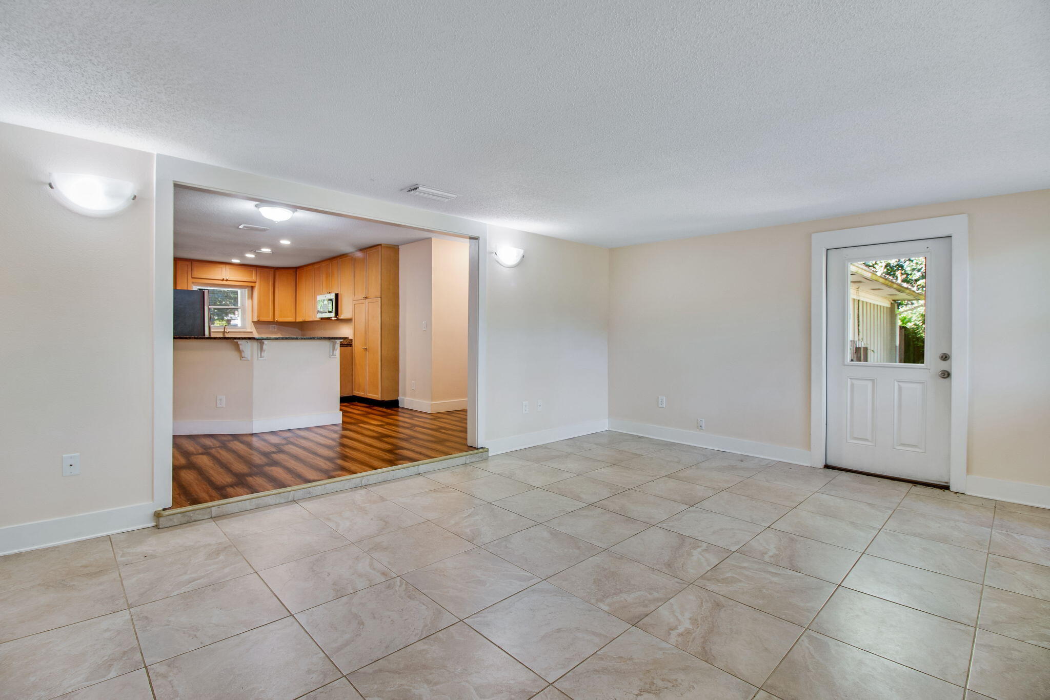 701 Planet Drive Destin, FL 32541 - Photo 16 of 25 a view of a kitchen with a sink and a refrigerator