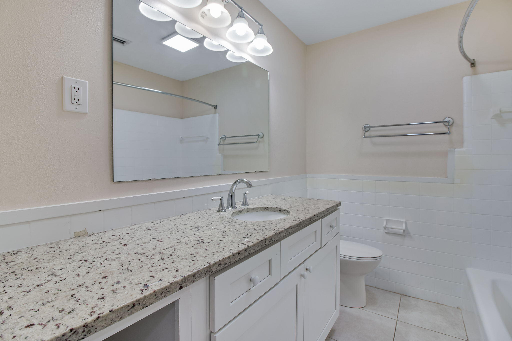 701 Planet Drive Destin, FL 32541 - Photo 20 of 25 a bathroom with a granite countertop sink a toilet and a mirror